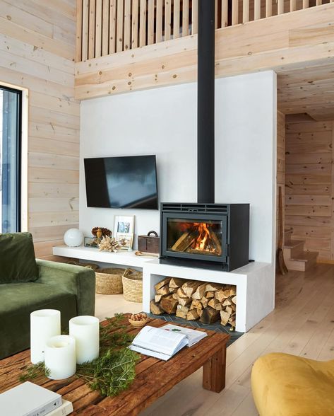 A Relaxed Cottage Interior Inspired By The Idyllic Serenity Of Its Surrounds | Style at Home Tv Next To Wood Stove, Scandi Wood Stove, Off Center Fireplace, Scandinavian Fireplace, Sea Biscuit, Stove Ideas, Wood Stove Fireplace, Freestanding Fireplace, Cottage Interior