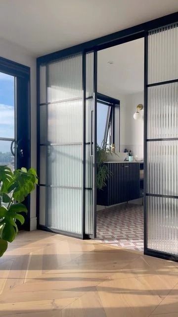 Partition Glass Wall: Designs, Price, Benefits and More Bathroom Glass Door Partition, Reeded Glass Interior Door, Fluted Glass Partition Sliding Doors, Glass Wall Bathroom Bedroom, Glass Wall Partition Design, Glass Separation Wall, Profile Partition, Sliding Glass Door Bedroom, Ribbed Glass Door