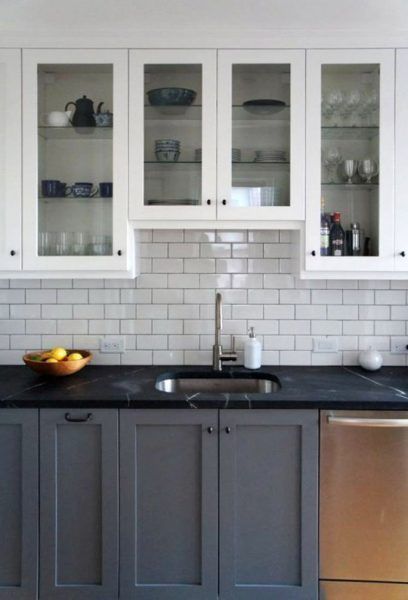 two tone gray and white kitchen cabinets with black countertop (via Apartment Therapy) Gray And White Kitchen Cabinets, Two Tone Kitchen Cabinets, Gray And White Kitchen, Black Countertops, Two Tone Kitchen, Kabinet Dapur, New Kitchen Cabinets, Dream Kitchens, Classic Kitchen