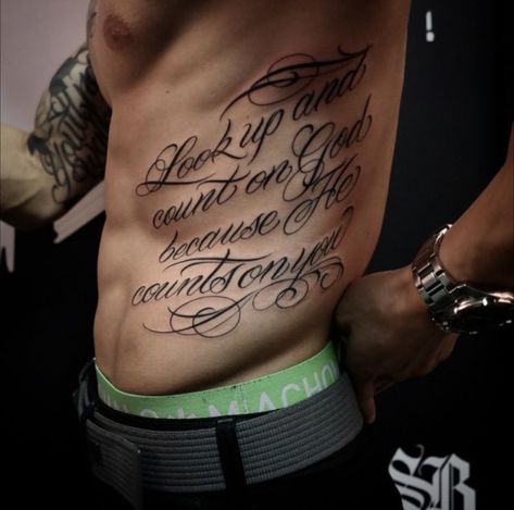 Side Stomach Tattoos For Guys, Mens Rib Tattoo, Chest Tattoo Words, Chest Tattoo Lettering, Side Body Tattoos, Rib Tattoo Quotes, Lower Stomach Tattoos, Rib Tattoos For Guys, Tattoo Lettering Styles