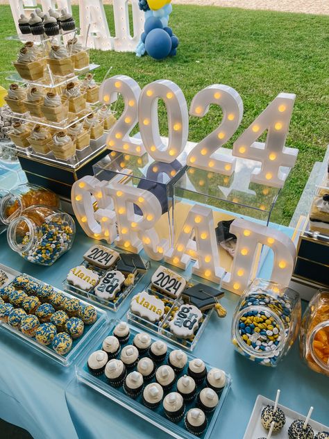 Serve your guests with fun and sweet treats. On the blog we share our first graduation party dessert table and it was a HUGE hit.   #graduation #gardparty #desserttable #candy #candybuffet #classof2024