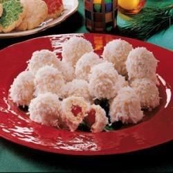 A juicy maraschino cherry is the pleasant surprise tucked inside these unique cookies. My mother clipped this recipe out of the newspaper more than 30 years ago. Cherry Snowballs, Snowballs Recipe, Coconut Snowballs, Dipped Cookies, Snowball Cookies, Unique Cookies, Pineapple Coconut, Maraschino Cherry, Christmas Goodies