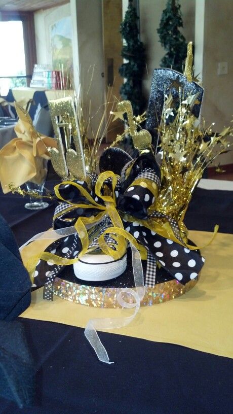 Dance team table centerpiece Ball Table Decorations, Dance Centerpieces, Converse Party, Cheer Decor, Sneaker Gala, Sneaker Party, Graduation Table Centerpieces, Dancing Competition, Banquet Table Decorations