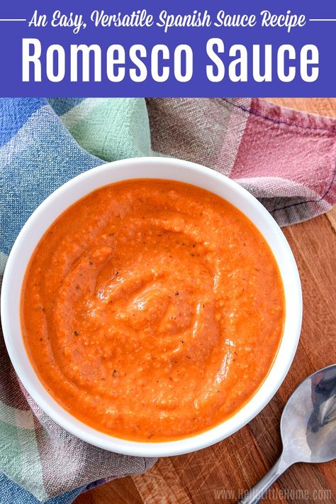 Learn how to make Romesco Sauce at home! Salsa Romesco is an easy Spanish Sauce that’s a great addition to any dinner! This healthy Romesco Sauce recipe uses simple ingredients: tomatoes, roasted red peppers, almonds, garlic, smoked paprika, vinegar, and olive oil. Authentic Romesco Sauce has many uses: top pasta, roasted vegetables, fish, chicken, or meat, or serve as an appetizer with calçots or crudité. Perfect for Spanish Food lovers, and Gluten free, vegan, vegetarian! | Hello Little Home