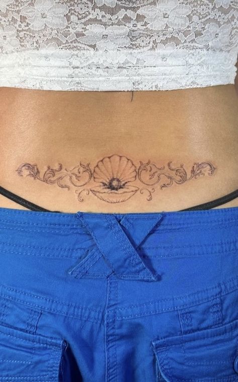 Mermaid Tattoo Placement Ideas, Pisces Inspired Tattoo, Ocean Lower Back Tattoo, Country Aesthetic Tattoo, Mermaidcore Tattoo, Clam Tattoo Pearl, Trap Stamp Tattoos Lower Backs, Water Theme Tattoo, Dainty Sleeve Tattoo