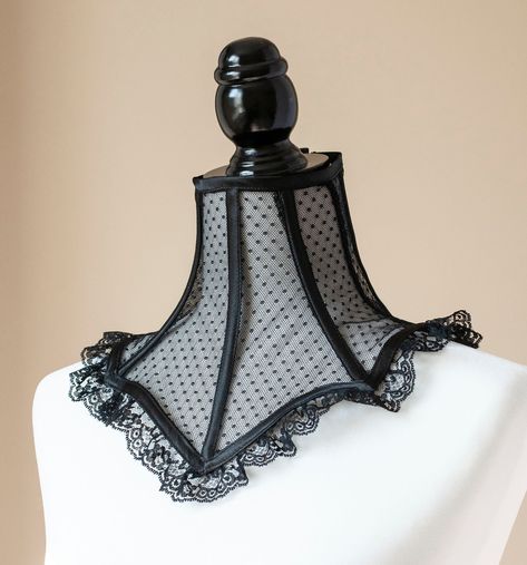 This elegant neck corset is made from delicate, stretch mesh with tiny polka dots, embellished with a black lace trim at the bottom - The neck piece is reinforced with spiral steel boning - It laces up at the back through a set of silver grommets - One size fits most-for a neck of about 12.5 inches in circumference - If you need a different size, please specify your neck measurement in the personalisation box or the notes to seller box at checkout To see other neck corsets, click here: https://w