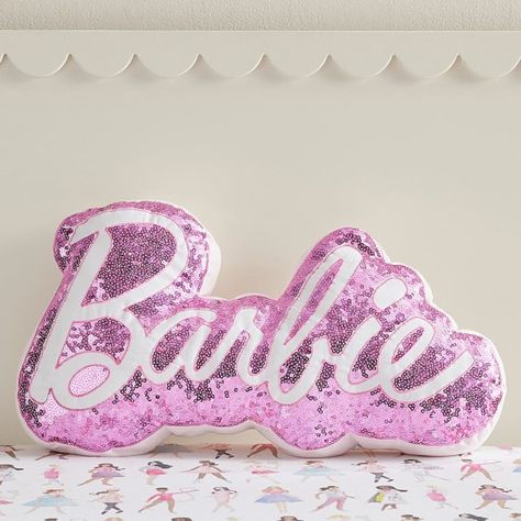 For a touch of shine to their space, add this plush Barbie(TM) pillow! With pink sequins and signature Barbie lettering, this shimmery piece adds fun flair to any chair or bed. DETAILS THAT MATTER Pillow is made from 100% cotton sateen. Cotton sateen is known for its luxurious sheen while providing supreme softness and ultra durability. Reverses to a 100% yarn-dyed cotton percale with a solid pattern. Yarn-dyed fiber has incredibly rich color that holds its vibrancy over time. Pillow is filled w