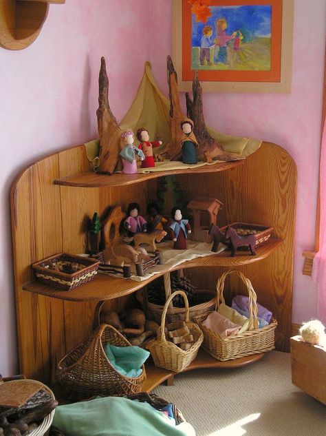 Gorgeous, grounded play area.  Just right.  Everything in its place and a place for everything.  And notice how they are 'put away' in a way that invites play.  So different than a toy box full of stuff.  This shelf is a story waiting to be played.  -Angelina soul-centered-parenting.com Waldorf Playroom, Waldorf Kids, Waldorf Kindergarten, Waldorf Montessori, Waldorf School, Waldorf Education, Rudolf Steiner, Nature Table, Play Spaces