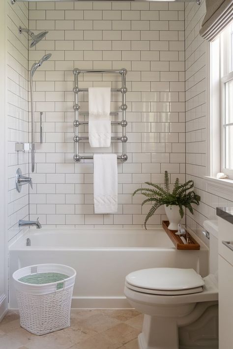 Clean lines meet timeless design in this small bathroom featuring pristine subway tiles and polished chrome hardware. Perfect for those who love understated elegance. #ModernClassic #SubwayTile #SmallBathroom White Subway Tile Shower With Brushed Nickel, White Bathroom Shower Ideas, Timeless Small Bathroom, Small Elegant Bathroom, Bathroom Subway Tile, Adu Interior, Small Bathroom Modern, Chrome Bathroom Fixtures, Subway Tile Bathroom