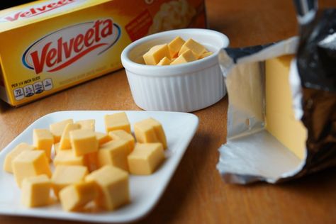 Melting Velveeta transforms it from a block of semi-soft cheese to a gooey topping or main dish component with a distinct American cheese flavor. It melts easily on the stovetop, in the microwave or in a slow cooker. Use it to make Velveeta cheese sauce, nachos or macaroni and cheese. Velveeta Cheese Dip, Velveeta Cheese Sauce, Melted Cheese Sauce, Easy Cheese Dip, Quick Mac And Cheese, Bacon Cheese Dips, How To Make Cheese Sauce, Stovetop Mac And Cheese, Easy Cheese Recipes