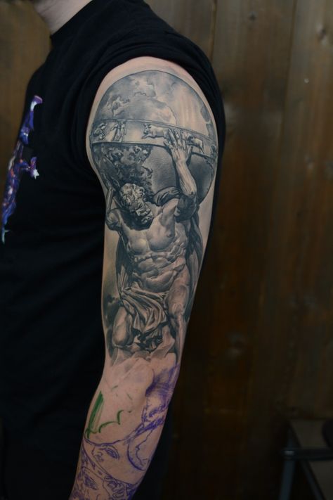 A tattoo of the greek titan god Atlas, holding the globe. Greek God Holding World Tattoo, Atlas God Tattoo, Small Torso Tattoo Men, Greek God Shoulder Tattoo, Man Holding World Tattoo, World On Shoulders Tattoos, Atlas Shoulder Tattoo, Atlas Holding The World Tattoo, Holding The World Tattoo