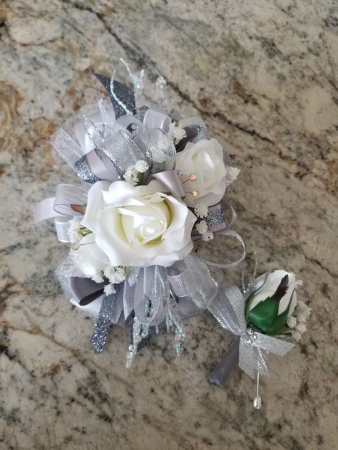 Silver Corsage Prom, Silver Prom Flowers, Grey Corsage, White And Silver Corsage, Silver Corsage, Prom Corsage White, White Corsage, Prom Flowers Corsage, Wrist Corsage Prom