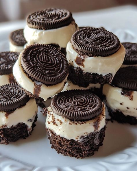 Oreo Cheesecake Bites Ingredients: 24 Oreo cookies 16 oz cream cheese, softened 1/2 cup granulated sugar 1 tsp vanilla extract 2 large eggs 1/2 cup sour cream 1/4 cup unsalted butter, melted Instructions: 1. Preheat the oven to 325°F (163°C) and line a muffin tin with paper liners. 2. Place an Oreo cookie at the bottom of each liner to form the base of the cheesecake bites. 3. In a large mixing bowl, beat the cream cheese and granulated sugar until smooth and creamy. 4. Add the va... Oreo Cheesecake Bites, Cheesecake Bar Recipes, Oreo Cookie, Cheesecake Bites, Yummy Comfort Food, Oreo Cheesecake, Fun Baking Recipes, Dessert Cupcakes, Muffin Tin