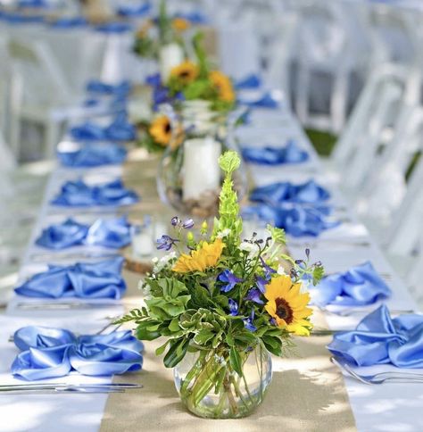 Small Sunflower Centerpieces, Sunflower Dinner Table, Summer Wedding Outside Ceremony, Flower Centerpieces For Round Tables, Wedding Table Centerpieces Sunflowers, Sunflower And Blue Bridal Shower Ideas, Sunflower And Blue Centerpieces, Sunflower And Blue Hydrangea Centerpieces, Blue Gingham And Sunflower Party