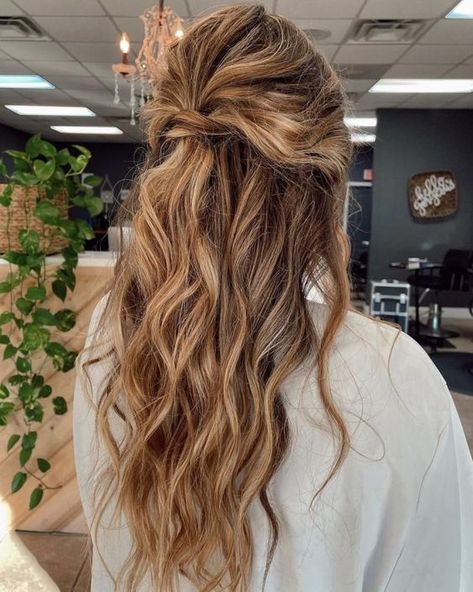 17. Long Messy Half-Updo with a Beachy Vibe. Here’s a cute idea of easy half-up half-down hairstyles that you can create by yourself. Just add loose waves if your hair isn’t naturally curly, make a knot, and get your compliments! Half Up Half Down Messy, Prom Hairstyles 2022, Wedding Half Updo, Curly Half Up Half Down, Half Up Hairstyles, Half Up Bun, Hair Half Up Half Down, Messy Curls, Hair Half Up