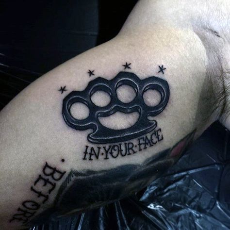 Guys In Your Face Inner Arm Bicep Brass Knuckles Black Ink Tattoo Small Creative Tattoos, Creative Tattoos For Men, Brass Knuckle Tattoo, Knuckle Tattoo, Dragon Tattoo Back Piece, Leto Joker, Brass Knuckle, Knuckle Tattoos, Dragon Sleeve Tattoos