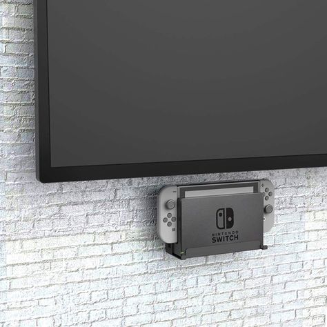 Mount your Nintendo Switch like art with Monzlteck's Wall Mount. It's sleek, sturdy, and holds your console securely. With easy installation, this minimalist mount frees up space and keeps your console safe. Show off your gaming setup in style. Game Console Organization, Shelf Holders, Console Organization, Video Wall, Wall Organization, Hanging Hooks, Gaming Setup, Display Boxes, Tv Wall