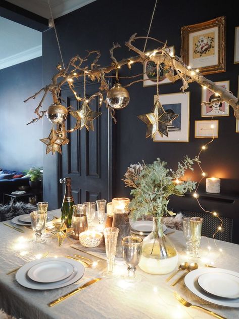 Create the perfect festive party styling for Christmas and New Year's Eve with this DIY hanging branch centrepiece and table setting featuring burnished brass, mixed metallics, faux sheepskin and candlelight #christmasdecor #christmasstyling #festivedecor #festivestyling #christmastable #christmasdecorinspo #scandichristmas #hyggechristmas Hosting Christmas Dinner, Branch Centerpieces, Koti Diy, Christmas Branches, New Year Table, Hygge Christmas, Festive Table Setting, Christmas Dining Table, Scandi Christmas