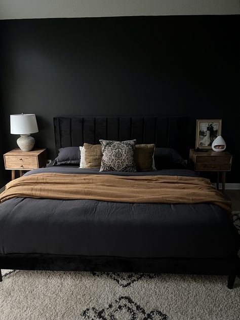 Black boho bedroom, modern organic, king bed with black linen duvet, black velvet headboard, natural wood nightstands, stone lamp, olive green velvet goose feather pillows, and burnt orange throw blanket Black Headboard Bedroom, Black Velvet Bed, Statement Bedroom, Olive Green Bedrooms, Bedroom Mirrors, Velvet Bed Frame, Moody Vintage, Grey Bedroom Decor, Black Bed Frame