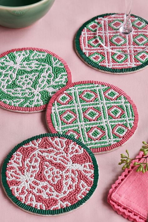 Add a touch of character while also protecting your table with this set of 4 Nina Campbell coasters. The set boasts intricately hand-beaded decorative designs in a mix of corals and greens. The geometric and trellis patterns along with the contrasting colours will provide a bold addition to your home. Set of 4. 2 different designs. Hand-beaded. Wipe clean only. 4 x Coasters Main 100% Glass. Backing 50% Cardboard, 50% Polyester.#Diy_Beaded_Coasters #Beaded_Coasters_Pattern #Beaded_Coasters_Diy #Beaded_Home_Decor Bead Decorations Home Decor, Beaded Coasters Diy, Crafts With Beads, Beaded Home Decor, Bead Coasters, Beaded Coasters, Beaded Decor, Beaded Patterns, Beads Art