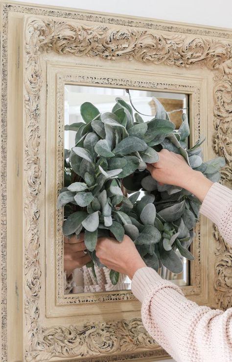 Wreath Over Mirror Living Room, Wreaths For Bedroom Wall Decor, Where To Hang Mirrors In House, Wreath On Mirror Farmhouse, Mirror With Wreath Wall Decor, Mirror With A Wreath, Farmhouse Wreath On Wall, Mirror With Greenery Around It, How To Hang Wreath On Mirror