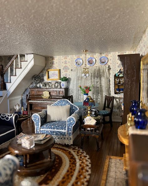 I finally finished the living room in the 1930s dollhouse. It was a little difficult trying to style it as there were not many examples of the types of items that would be in this age of house. And, of course, I made more work for myself by adding a piano and pipe table. I'm really happy about the way it turned out! #dollhouse #dollhouseminiatures #miniatures #minis #minismakemehappy #12thscale #1930sdollhouse #dollhousedecor #dollhousedecorating Southern Gothic Dollhouse, 1930s Dollhouse, Dollhouse Aesthetic, Doll House Living Room, Work For Myself, Dollhouse Inspiration, Dollhouse Decorating, Dollhouse Living Room, Pipe Table