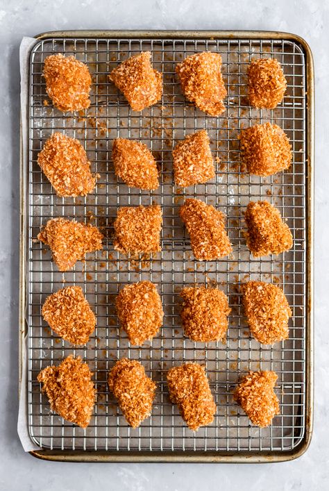 These are the BEST crispy baked chicken nuggets you'll ever make! This delicious, healthy chicken nuggets recipe takes just about 30 minutes from start to finish and uses super simple ingredients like panko breadcrumbs, chicken breast and spices. Serve with honey mustard, ketchup or your favorite BBQ sauce. Kid-friendly and adult approved! #chicken #chickennuggets Healthy Chicken Nuggets, Chicken Nuggets Recipe, Frozen Chicken Nuggets, Baked Chicken Nuggets, Homemade Chicken Nuggets, Healthy Baked Chicken, Chicken Nugget Recipes, Nuggets Recipe, Crispy Baked Chicken