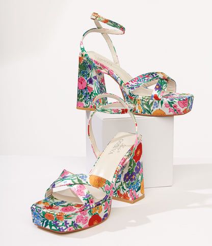 These charming platform sandals feature a floral print on a classic white background, perfect for adding a touch of flower power to any outfit. The satin-like material and crisscross upper design give these platforms a unique and stylish look that will have you standing out from the crowd. With an adjustable ankle strap for the perfect fit, these sandals are as comfortable as they are cute. Complete with a 1.25 inch platform and 4.25 inch heel.Available while supplies last. Colorful Platform Heels, Formal Ideas, Colorful Heels, Funky Shoes, Floral Heels, Fresh Shoes, Europe Trip, School Dances, Shoe Fits