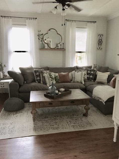 Brown Gray Couch Living Room Ideas, Cream Couch Grey Floors, Modern Farmhouse Grey Couch Living Room, Charcoal Grey Sectional Decor, Modern Farmhouse Grey Living Room, Grey Couch Wood Furniture, Grey Sofa Dark Wood Furniture, Gray And White Farmhouse Living Room, Cozy Living Room Dark Floors