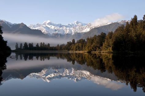 This photo of Lake Matheson shows specular reflection in the water of the lake with reflected images of Aoraki/Mt Cook (left) and Mt Tasman (right). The very still lake water provides a perfectly smooth surface for this to occur. References Drawing, Specular Reflection, Aoraki Mount Cook, Lake Reflection, Reflection Photography, Green Travel, Visit Australia, Lake Water, Principles Of Design