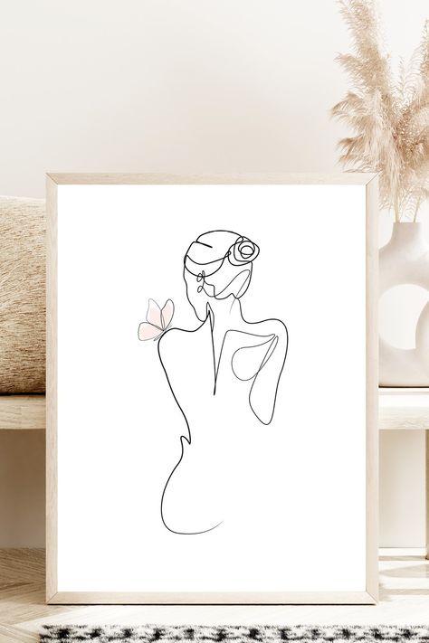 Elegant minimalist line art drawing of a woman undressing with a delicate pink butterfly on her shoulder. Set in a natural frame against soft, beautiful boho decor with subtle lighting. Woman Minimalist Drawing, Apartment Mural, Minimalist Line Art Woman, Butterfly Decorations Bedroom, Pink Line Art, Feminine Line Art, Butterfly Boho, Beauty Transformation, Person Drawing