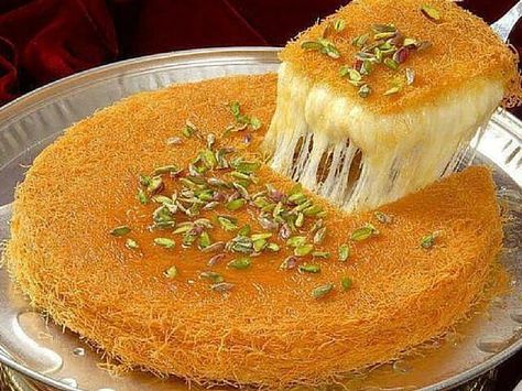 A Brief History Of Kunafa Kunafa is a well-known Arabic dessert. It is a syrup soaked cheese pastry. Some say it dates back to the Ottoman Empire, others say its origin is from Turkey, Palestine, Egypt, or Greece ( see the editor’s note below ). Well, whatever it’s true origin, it is a favorite of… Kunafa Recipe, Arabisk Mad, Istanbul Food, Arabic Sweets Recipes, Arabic Desserts, Arabic Dessert, Middle Eastern Desserts, Arabian Food, Turkish Desserts