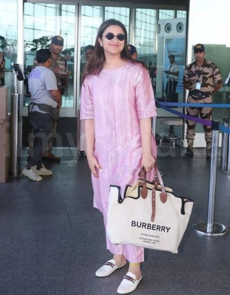 Parineeti Chopra is riding high in her personal life as she recently got engaged to AAP MP, Raghav Chadha. Ever since her engagement, Parineeti has been dropping adorable glimpses with her soulmate, Raghav. The actress was recently papped at the airport, and she looked stunning as she donned a breezy outfit.
 
 Parineeti Chopra donned a metallic 'kurta' worth Rs. 28K
 
 For her airport look, Parineeti opted for a metallic nova kurta set from the brand Anavila worth Rs. 28,000.... Parineeti Chopra Outfits, Pareeniti Chopra, Kurtis Style, Raghav Chadha, Parneeti Chopra, Kurtis Design, Stylish Kurtis, Engagement Look, Stylish Kurtis Design