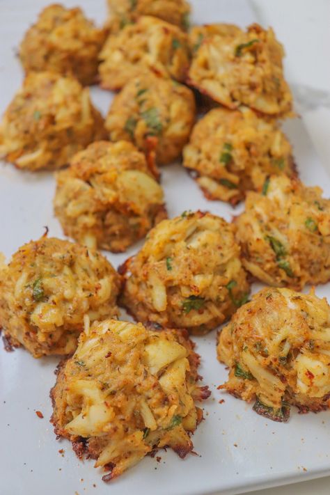 Crab+Balls:+A+Bite-Size+Delicacy+Bursting+with+Flavor Crab Balls, Lump Crab Meat, Seafood Medley, Lump Crab, Cajun Dishes, Cajun Cooking, Andouille Sausage, Crab Meat, Fresh Seafood