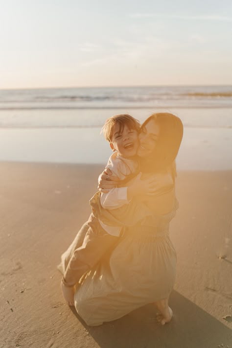 mom and son hugging during sunrise on the beach Mother Son Beach Photoshoot, Mother And Son Beach Photos, Mom And Son Beach Photo Ideas, Mother Son Beach Photos, Mom And Son Beach Pictures, Beach Mom Aesthetic, Soulmate Photos, Jenny Billingham, Hawaii October