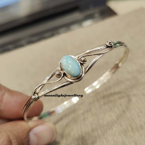 Welcome to my shop, Larimar Bangle, 925 Silver Bangle, Larimar Gemstone Bangle, Gemstone Bracelet, Sterling Silver Bracelet, Gift For Wife, Gift For Her. All my Designs are original. Stone - Larimar Stone Shape - Oval This Bangle is for Women You will receive a Bangle like the one in the pictures This Bangle have 925 Stamp Suitable for use in everyday situations, or can also be used as a gift. Unique design will make a special attraction for the wearer. I make my jewelry with passion and love. The perfect gift for a Special occasion Wholesale Orders Accept on Wholesale Price All Pieces Have 925 Stamp Silver Bangle Design For Women, Silver And Gemstone Jewelry, Larimar Bracelet, Bangle Silver, Larimar Jewelry, Gemstone Bangle, Larimar Stone, Sterling Silver Bangle, Handmade Bangles