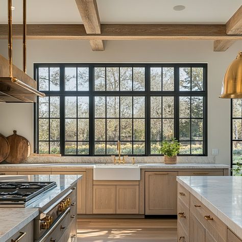 Imagine a kitchen made with rift cut white oak with beautiful views out the windows, alabaster quartz tops. What a perfect place to be. Our Forest & Arden cabinetry is Amish made and custom to every home we touch. #kitchen #kitchendesign #cabinetry #whiteoak #whiteoakfloors #whiteoakcabinetry #beams #goldhardware #kitchenandbath www.allarden.com Triple Kitchen Window, Kitchen Sink Big Window, Kitchen With Windows Beside Range, Large Kitchen Window Over Sink Farmhouse, Huge Kitchen Window, Kitchen With Tall Windows, Kitchen With Picture Window, Window Wall In Kitchen, Big Window Kitchen