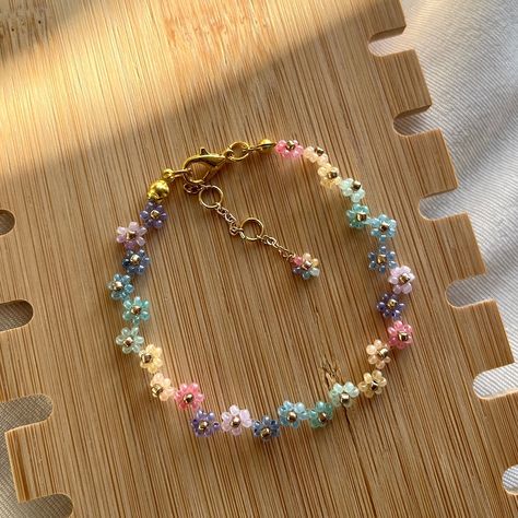 Rainbow colour is now available in the Zigzag Collection! 🌈 Shop this colour in Etsy, or customise your own bracelet (swipe right for all 24 colour options✨) 🤍 All silver and gold beads are Japanese TOHO beads to prevent colour fading and ensure a uniform pattern. #handmade #jewellery #jewelry #aus #smallbusiness #smallbusinessaustralia #bracelets #handmadejewelry #handmadebracelet #handmadebracelets #smallbusinesssupport #bracelet #handmade #handmadecrafts #handmadejewellery #cutebracelet... Bead Jewellery Patterns, Zig Zag Flower Bracelet, Bead Patterns Bracelet, Bead Bracelet Patterns, Colourful Bracelet, Handmade Bead Jewellery, Beaded Jewelry Pattern, Rainbow Colour, Diy Jewelry Unique