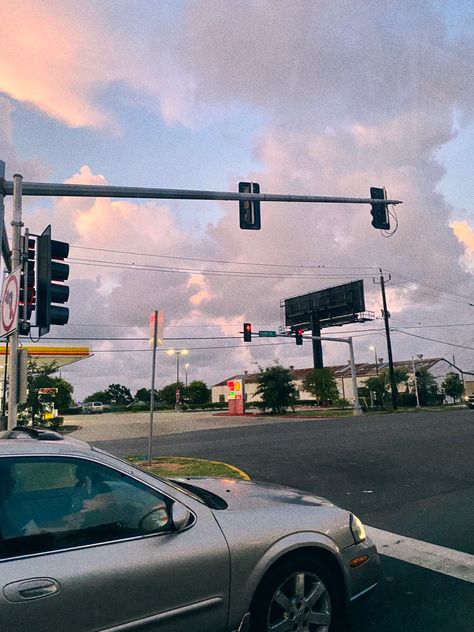 photo of a four way intersection taken out of the passenger window with a car to the left-hand side and large fluffy clouds in the pink/blue sky (the photo has a grain filter on it) Grain Photos Aesthetic, Grainy Aesthetic, Grainy Photos, Dreamy Sky, Grain Effect, Galveston Tx, Sky Photo, White Balance, Sky Photos