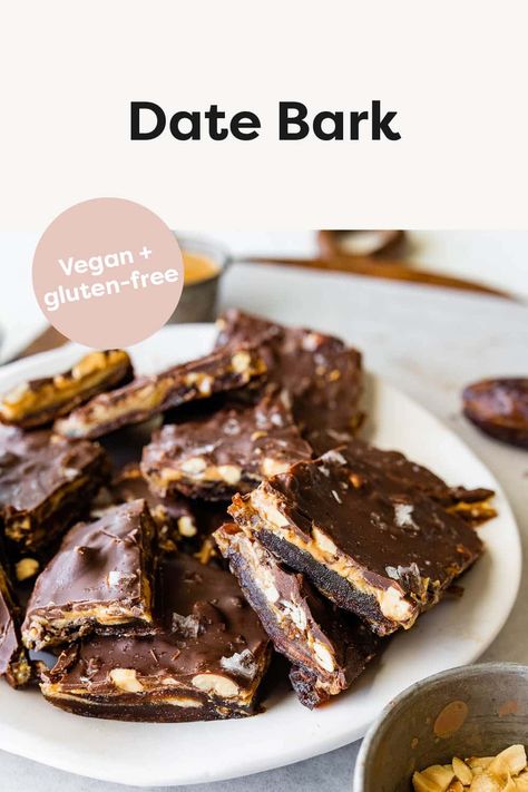 This viral date bark recipe combines medjool dates with peanut butter, chocolate and peanuts. It tastes like a Snickers bar and is the perfect healthy treat to keep stocked in your freezer. Vegan + gluten-free. Bars With Dates Healthy Snacks, Dates Almond Butter Chocolate, Chocolate Date Bars Recipe, Smashed Dates With Chocolate, Chocolate Seed Bars, Peanut Butter Dates Chocolate, Healthy Snickers Dates, Dates With Peanut Butter And Chocolate, Date Bark Recipe