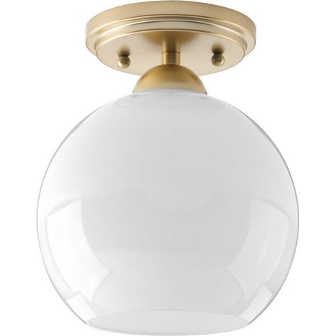 The Carisa Collection Flush Mount from Progress Lighting is an elegant and sophisticated light fixture crafted from high-quality glass with a Vintage Gold finish. Measuring 7.38 inches in width and 8.75 inches in height, it is designed to make a statement in any room. This fixture accommodates a single 75-watt bulb and is suitable for use in environments with moisture, making it versatile for various settings. Inspired by mid-century fashion, it features a glossy white glass globe supported by a Glass Globes, Progress Lighting, Semi Flush Mount Lighting, Mid Century Modern Style, Flush Mount Lighting, Glass Globe, Glossy White, Flush Mount Ceiling, Flush Mount Ceiling Lights