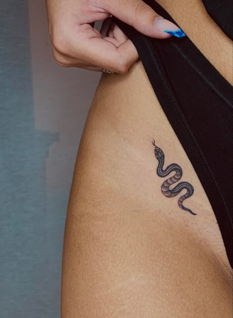 Snake Tattoos Behind The Ear, Tiny Pelvic Tattoo, Small Snake Tattoos For Women Hip, Snake With Fangs Tattoo, Fine Line Snake Spine Tattoo, Small Rattlesnake Tattoo, Small Snake Tattoo On Hip, Pelvic Hip Tattoo, Snake Tattoo Thigh Women