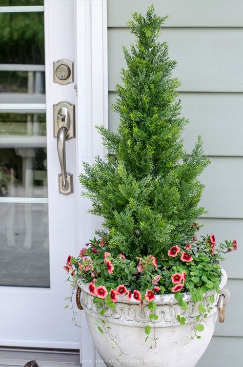 Faux shrubs and bushes are a great alternative to the real thing when planted in pots and containers for your porch.  Learn where to find these plants and how to make them look as real as possible to easily enhance your home's curb appeal.  |  www.andersonandgrant.com Shrubs In Pots Front Porch, Outdoor Faux Planter Ideas, Front Porch Plants, Bushes And Shrubs, Porch Plants, Privacy Plants, Porch Flowers, Container Garden Design, Porch Planters