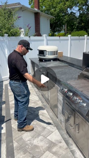 Ageless Masonry on Instagram: "Check out the latest outdoor kitchen !! It’s got everything you could ever want !! Three ways to cook 🥩 🍕! Do you want help with a backyard just like this one ?? .
.
.
#outdoorkitchen #outdoorkitchendesign #outdoorkitchenfabulous #outdoorkitchens #outdoorkitchendesigner #hamptonsfabulous #outdoorkitchensandgrills #outdoorkitchenideas #outdoorcooking #outdoorkitchencabinets #outdoorkitchens_of_insta #outdoorkitchenbuilder #houtoven #outdoorpizzaovens #pizzapartyshop #woodfirepizzaoven #outdoorkitchenbbq #pizzapartyoven #outdoorkitchendesignstore #bestoutdoorkitchen #vedovn #outdoorkitchengoals #landscaperemodel #outdoorliving #fornopizza #mobilewoodfiredpizza #outdooroven #outdoorküche #pizzaovens #pizzapartyovens" Built In Traeger Outdoor Spaces, Bbq Pits Ideas Backyards, Modern Barbecue Design, Grill Areas Outdoor Diy, Outdoor Refrigerator Ideas, Outside Kitchen Ideas Outdoor Spaces, Diy Outdoor Kitchen Plans, Cheap Outdoor Kitchen Ideas, Outdoor Barbeque Area