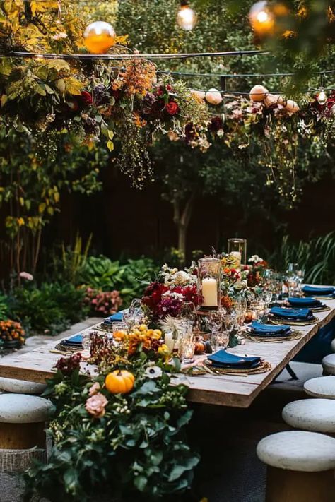 A festive fall garden party setup with pumpkins, banners, and cozy autumn decorations. Outdoor Fall Party, Outdoor Fall Parties, Autumn Harvest Party, Fall Garden Party, Fall Party Decor, Garden Party Ideas, Garden Soiree, Indoor Garden Party, Fall Harvest Party