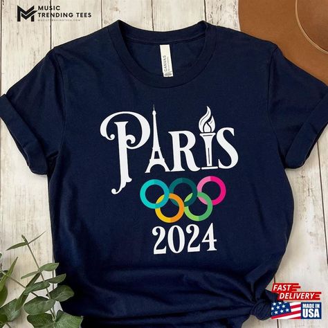 Paris 2024 Olympic Games T Shirts T-Shirt Olympics Classic Sweatshirt Check more at https://musictrendingtees.com/product/paris-2024-olympic-games-t-shirts-t-shirt-olympics-classic-sweatshirt/ Olympic Shirts Ideas, Olympic Background, Paris 2024 Olympic Games, Olympic Shirts, Olympic Crafts, Olympic Colors, Olympic Theme, Olympic Party, Olympics 2024