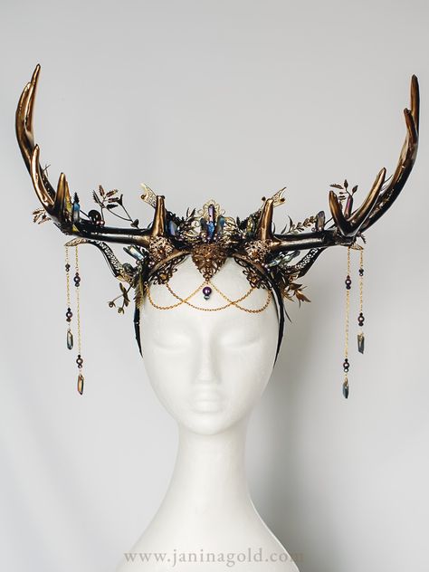 Make a statement with this stunning black and gold fantasy headpiece featuring intricate filigrees, antlers, and sparkling titanium quartz crystals. With elegant touches of purple pearls, this headpiece is the perfect accessory for any special occasion. Whether you're looking for a unique wedding headpiece, a bold costume accessory, or a standout piece for a photoshoot, this headpiece is sure to turn heads. Shop now and add a touch of glamour to your look! Deer Antlers Headpiece, Fantasy Antlers Headdress, Fantasy Head Piece, Antler Crown Headpieces, Fae Headpiece, Bone Headpiece, Fantasy Jewelry Headpieces, Druid Headpiece, Head Jewelry Headpieces