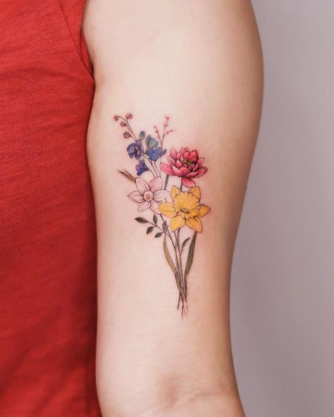 31 Beautiful Daffodil Tattoo Ideas for Men & Women in 2023 Multi Flower Tattoo, Tattoo Writing Fonts, Flower Tats, Tattoo Elements, Arm Wrap Tattoo, Realistic Flower Tattoo, Simple Flower Tattoo, Baby Tattoo, Daffodil Tattoo