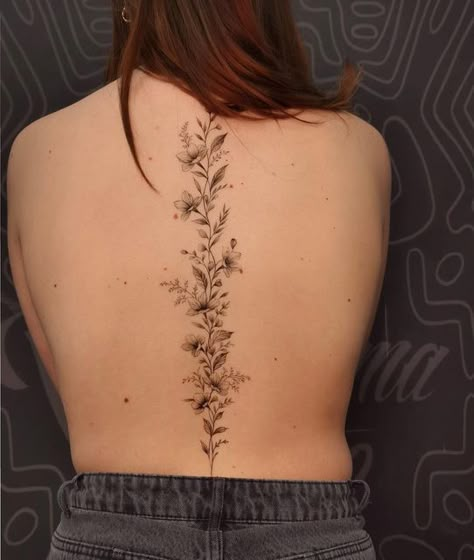 Violet Spine Tattoo, Fine Line Flower Spine Tattoo, Wild Flower Spine Tattoo, Long Spine Tattoo, Spine Tattoos Unique, Wildflower Spine Tattoo, Floral Spine Tattoos For Women, Simple Spine Tattoo, Floral Spine Tattoo