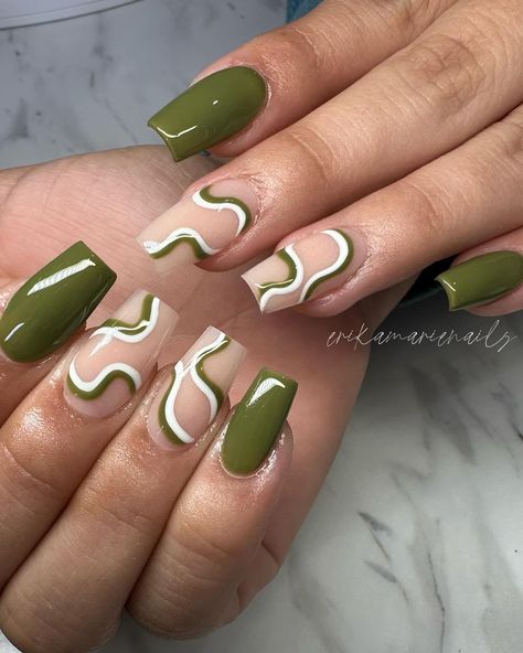 Army crawl your way to the nail salon to get army green nails because you'll feel like your MIA if you don’t get these cool, and trendy designs on your fingers. Click the article link for more photos and inspiration like this // Photo Credit: Instagram @erikamarienails // #armygreenacrylicnails #armygreenmattenails #armygreennaildesign #armygreennaildesigns #armygreennailpolish #armygreennails #greennails Green And White Nail Designs Short, Green Short Nails With Design, Green Nails Ideas Coffin, Army Green Almond Nails, Fall Green Nails 2024, Short Olive Green Nails Designs, Short Nails Green Design, Olive Green Nails Short, Short Square Green Nails